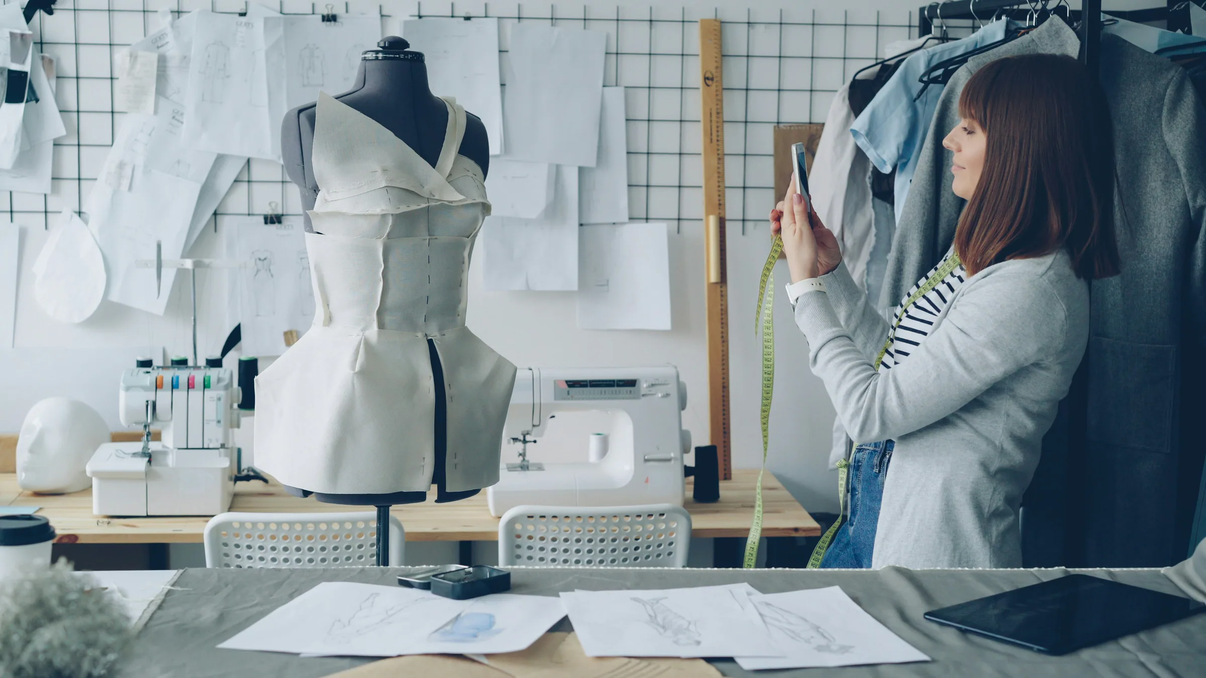 Fashion designer photographing a garment in a studio