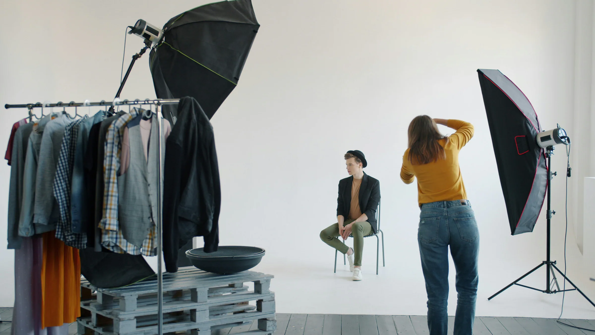 Photographer working with a model in a fashion studio